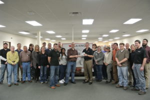 John King presents the check to the Bikes for Kids program Friday, December 19th, in our corporate headquarters in NC.