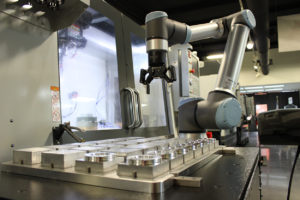 Machine tending automation with end of arm gripper