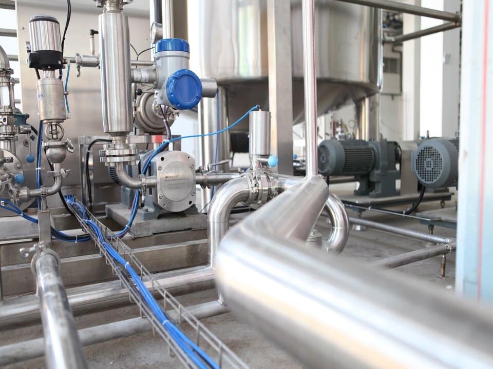 inside a process plant with valves and tanks