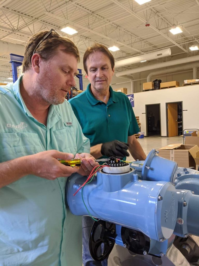 cross valve experts testing a valve