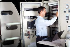 Service technician working with panel